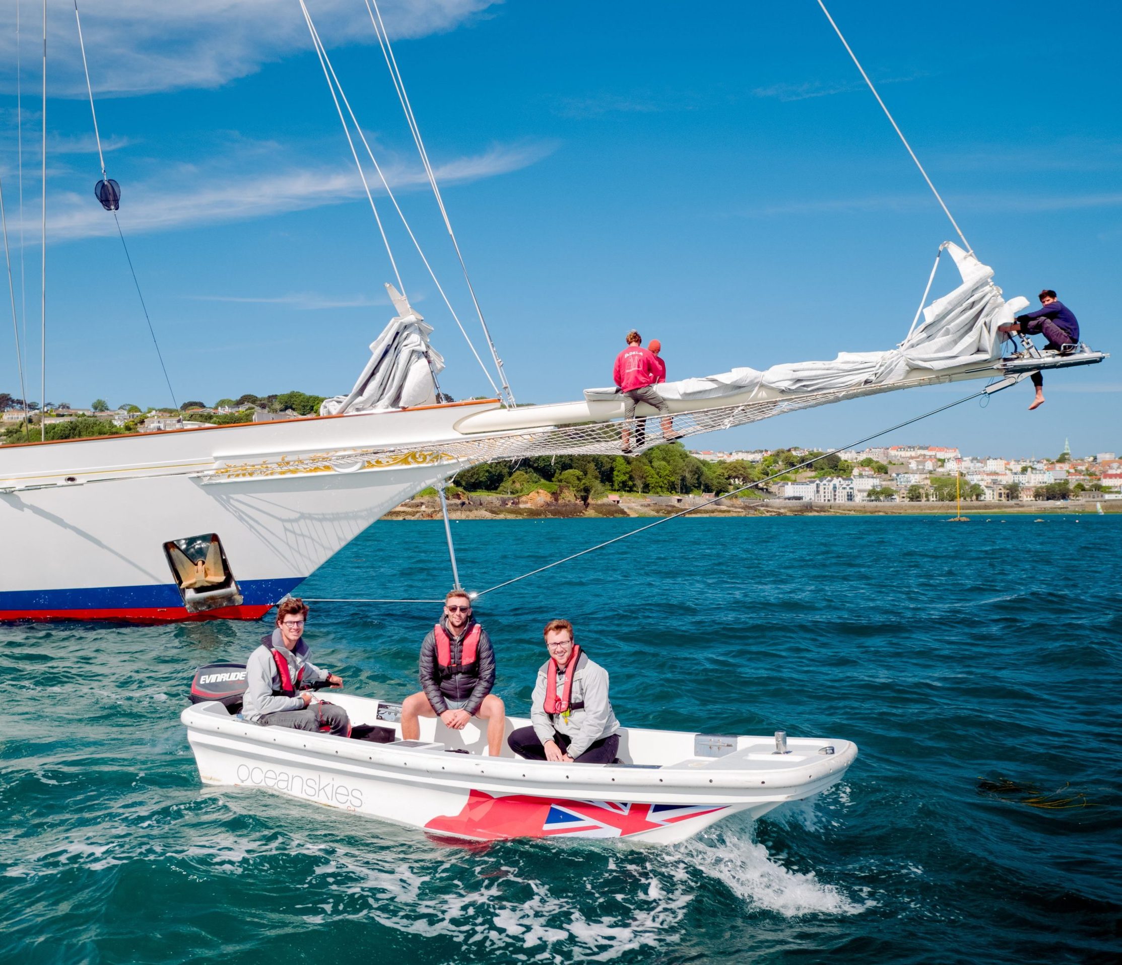 Oceanskies Yacht Registration team helping a visiting yacht on the Oceanskies dory.